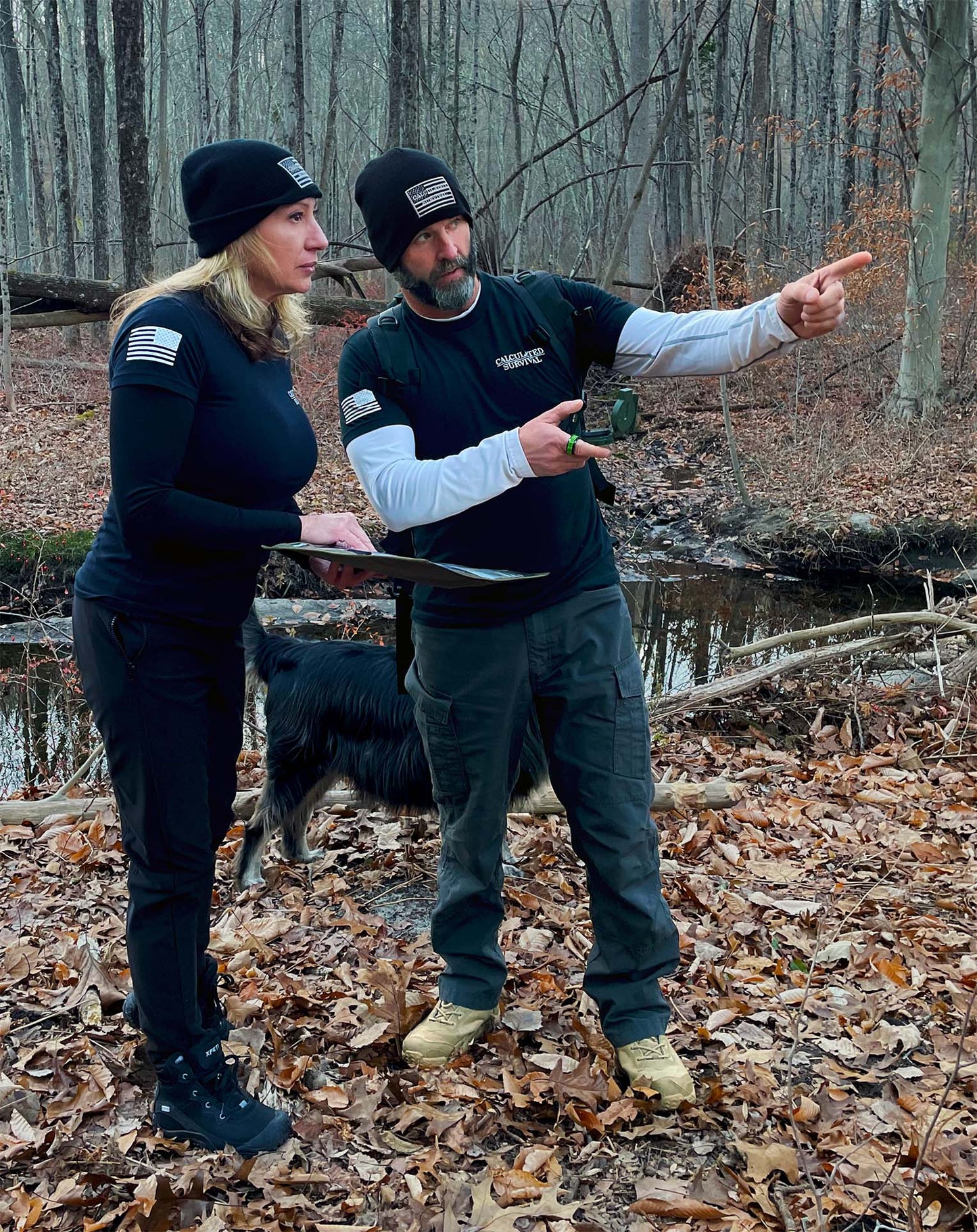 2 people wearing black beanie hat one pointing