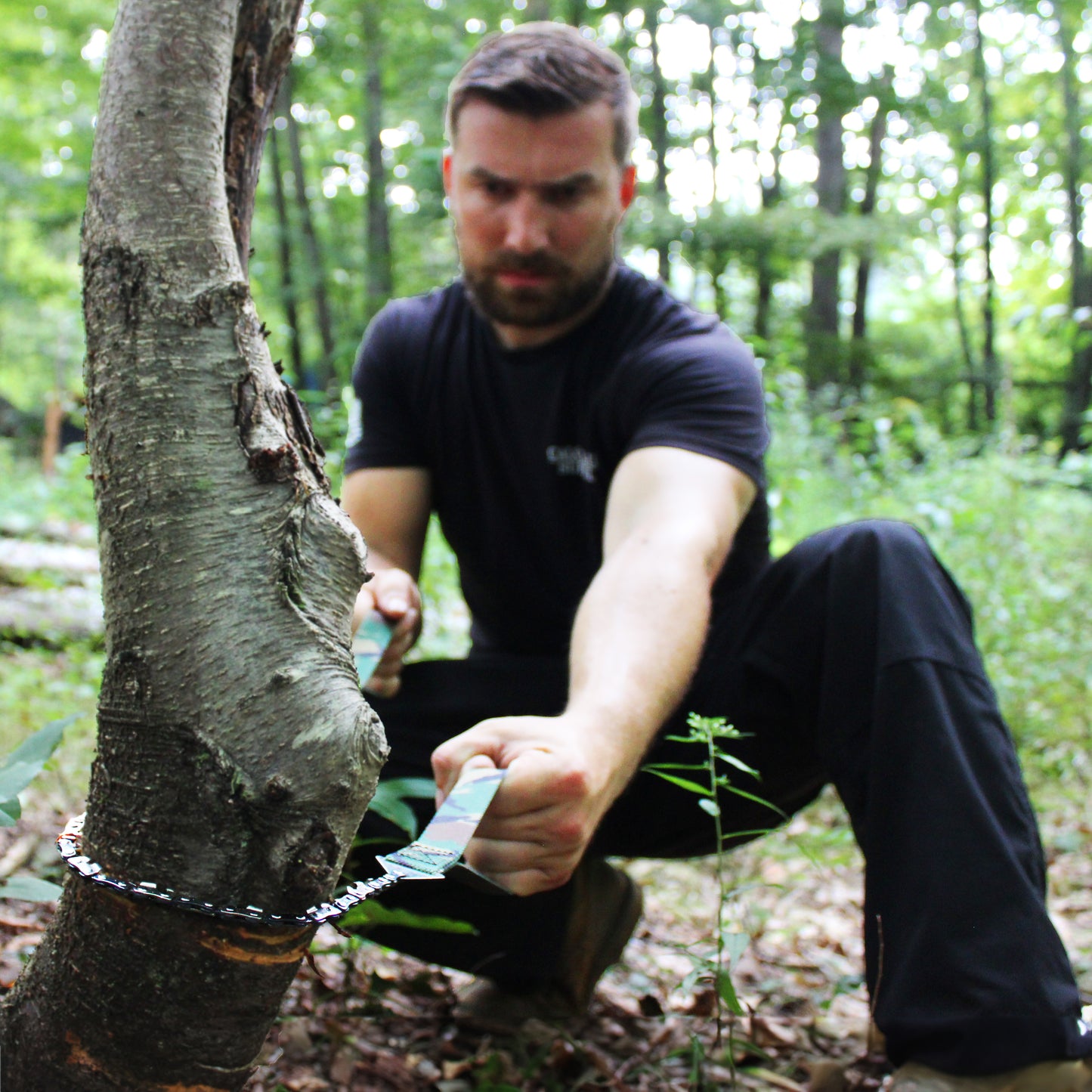Pocket Chainsaw sawing tree